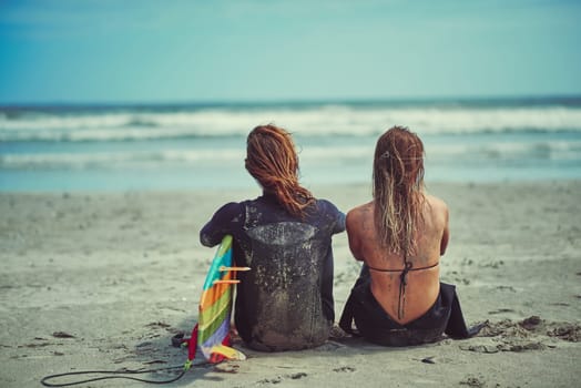 And in that moment, life was complete. a young couple surfing at the beach