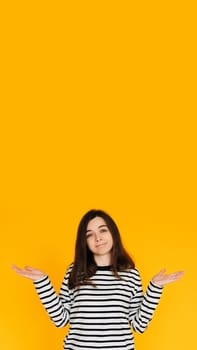 Visual of Assertive Woman: Attractive Lady Displaying 'No Answer' Gesture with Both Hands - Nonverbal Communication Concept Isolated on Bright Yellow Background.