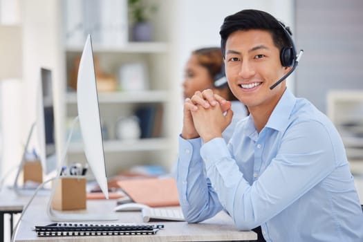 Business man, portrait and call center consultation in a office working on a computer. Smile, Asian male worker and web support advice of a contact us employee with professional communication at job.