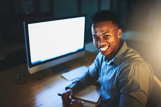 Late nights are part and parcel of success. Cropped portrait of a handsome young businessman working late at night in a modern office