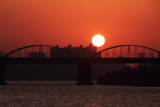 sky,afterglow,sunrise,dusk,water,cloud,orange,sunlight,sunset,architecture,blue,bridge,evening,horizon,light,moon,moonlight,night,river,sea