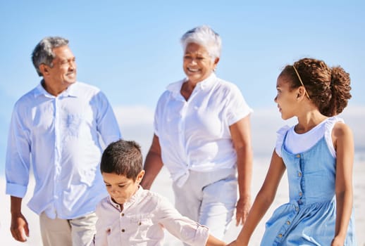 Beach, grandparents or happy kids holding hands, walking or smiling in summer as a family in nature. Grandmother, senior grandfather or young children siblings bonding or taking walk together at sea.