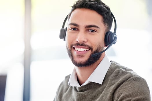 Man, portrait and happy call center worker with headset, smile and professional mindset for customer service, support or help. Face, person and working in telemarketing, crm or online consulting.
