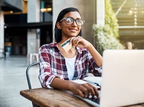 Happy woman, student and thinking on laptop with credit card for ecommerce, payment or campus loan. Female person or university learner in thought on computer for online shopping, debit or banking.