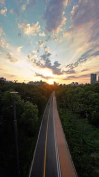 sky,afterglow,atmosphere,dusk,tree,cloud,sunlight,plant,architecture,daytime,horizon,light,morning,nature,road