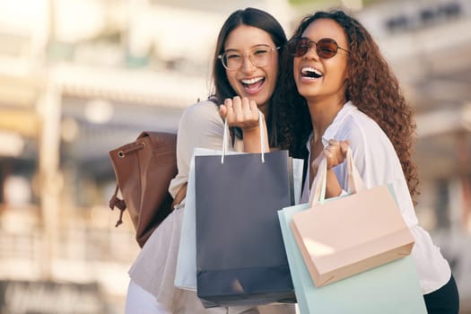Portrait, shopping or women with bags, city or retail with boutique items, buyers or fashion. Face, female customer or friends with discount, sales or consumer choice with happiness, funny or outdoor.