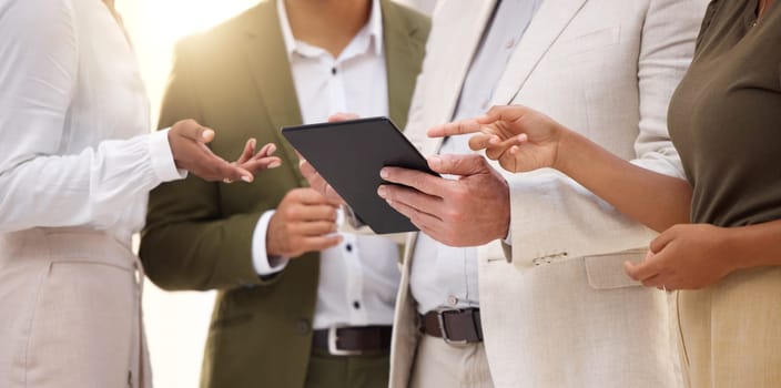 Hands, tablet and collaboration with a business team working on research together in their office. Teamwork, meeting or planning with a man and woman employee group discussing strategy at work.