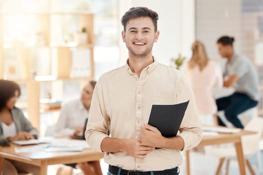 Happy, man and portrait in office with documents ready for financial work strategy presentation. Smile, excited and optimistic finance worker holding professional report and notes in workplace