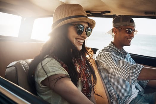 Whats a summer break without a road trip. a young couple enjoying a road trip along the coast