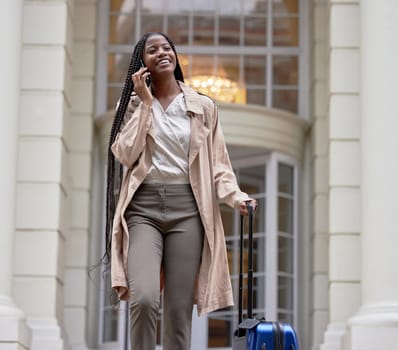 Travel, suitcase and black woman on business phone call in city for conference, global meeting or work trip. Corporate leader, hotel and girl talking on smartphone for cab, taxi and transport service.