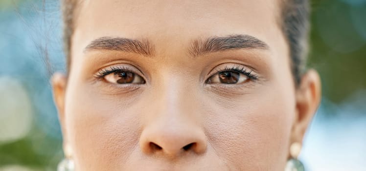 Face portrait, eyes and indian woman outdoor for vision, health and wellness in nature with makeup, cosmetics and dermatology care. Model, zoom and skin while staring with brown eyes for focus.