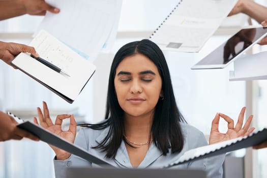 Busy, stress and woman meditate in the office, hands holding paperwork, documents and tablet around her. Stress free, workload and calm Indian woman in workplace for peace, zen and relaxed lifestyle.