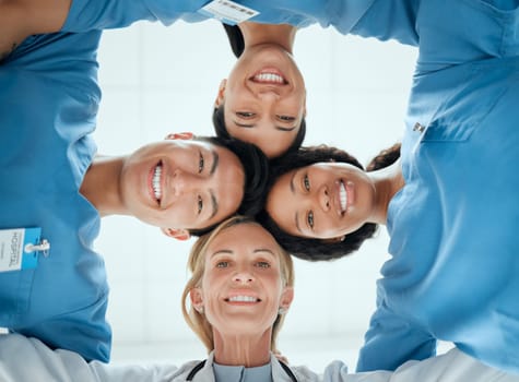 Diversity, teamwork or faces of nurses in huddle with a happy smile collaboration for healthcare goals. Trust, team building or low angle of medical doctors with group support, motivation or mission.