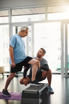 Each day is chance to rise with your determination. a young male physiotherapist assisting a senior patient in recovery