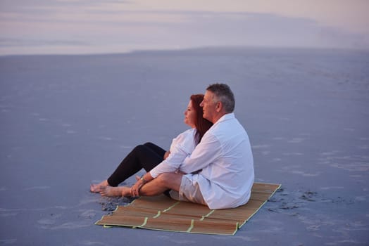 Living life in the slow lane. a mature couple relaxing together on the beach