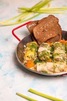 delicious cabbage rolls with a piece of rye bread.