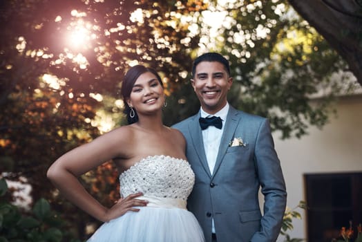 Portrait, happy and couple for wedding and celebration in the garden to celebrate their commitment. Marriage, man and woman in outdoor together with happiness for celebration with love and smiling