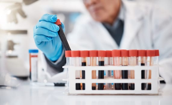 Blood, test tube and hands of scientist in laboratory with sample for research, medical study and science. Healthcare, pharmaceutical and old man with vial for dna testing, biology and rna analysis.