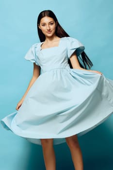 space woman smile expression copy fashion portrait model female dance background blue young beautiful studio slim attractive style dress vogue summer girl