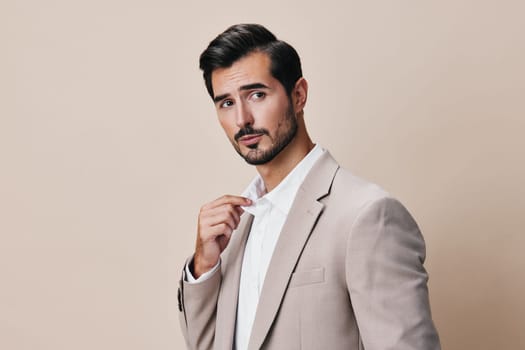 isolated man background handsome person guy occupation white businessman standing smiling executive successful portrait happy young stylish suit beige business copyspace