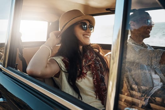 Happy couple, summer and on a road trip in a car for freedom, travel and holiday. Smile, relax and a young man and woman in transportation driving for a vacation, date or an adventure together.