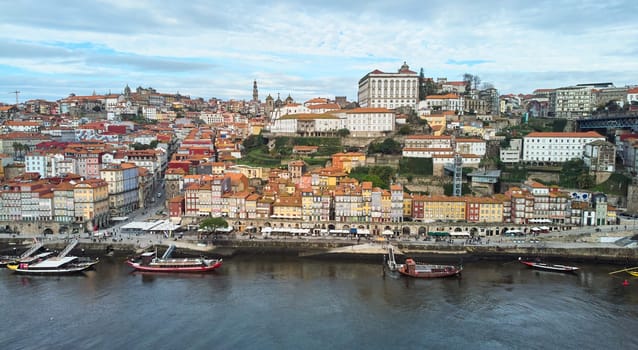 Porto, Portugal - 12.25.2022: Aerial view of the old city of Porto. Portugal old town ribeira aerial promenade view with colorful houses. High quality photo