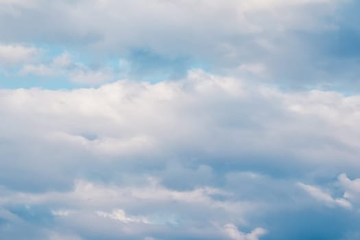 Background of blue sky with white clouds. Natural backdrop