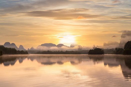 Ban Nong Thale the natural scenery of the sunshine in the morning (mountains, lakes, trees, fog) at Krabi, Thailand.