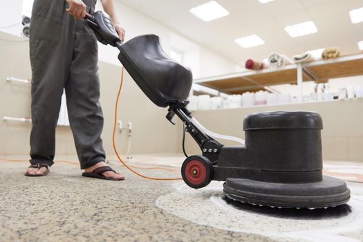 Carpet chemical cleaning with professionally disk machine. Early spring cleaning or regular clean up. High quality photo