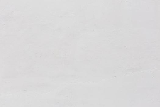 shabby dry white plaster under direct sunlight texture and full frame background
