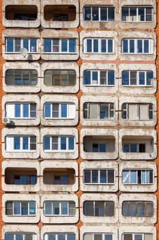 full frame background and texture of typical mid-russian concrete and brick high rise condominium residential building.