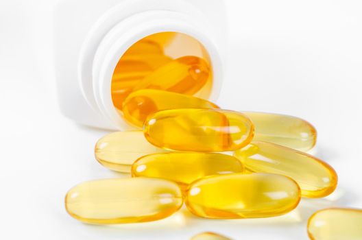 Omega 3 gel capsules. Fish oil pills. Healthy omega-3 in bottle.