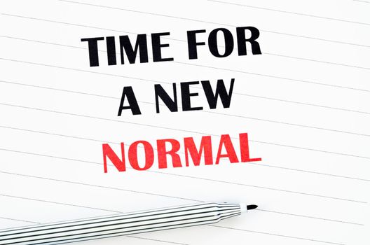 Time for a new normal with black pen on paper. Life after pandemic concept.