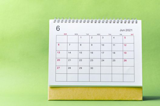June Calendar 2021 on green background.