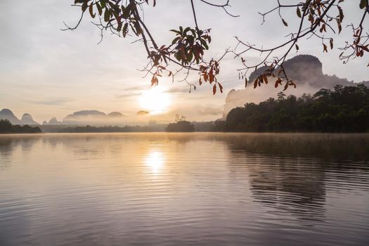Ban Nong Thale the natural scenery of the sunshine in the morning (mountains, lakes, trees, fog) at Krabi, Thailand.