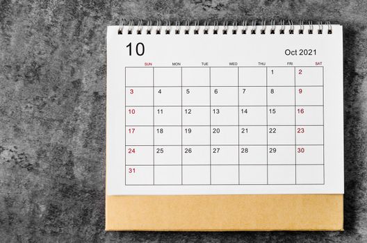 October Calendar 2021 on wooden table background.