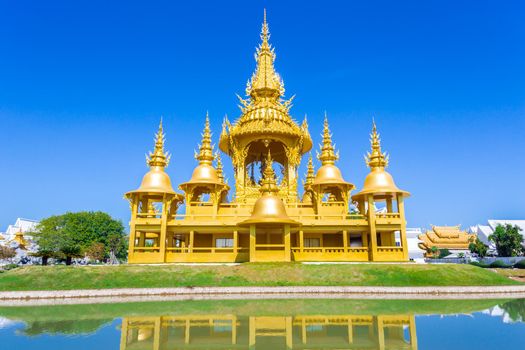 Gold pagoda in Wat Rong Khun or White Temple, Landmark, Chiang Rai, Thailand.