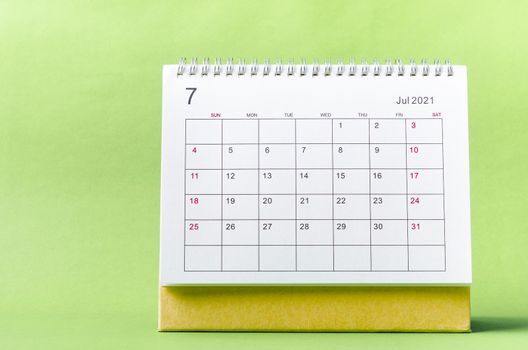 July Calendar 2021 on green background.