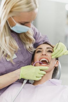 Shot of a young woman having dental work done on her teeth.