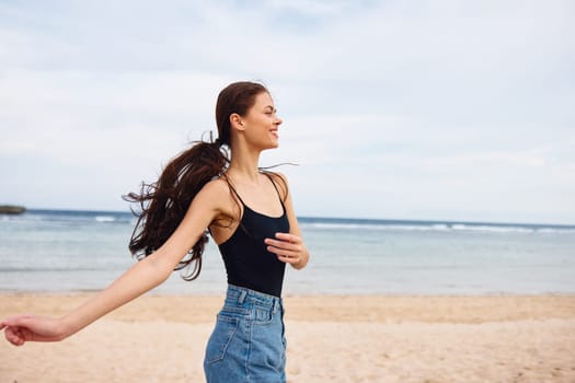 woman lifestyle positive girl smile summer walking ocean travel space running body freedom female sea copy beach flight person beautiful young sunset