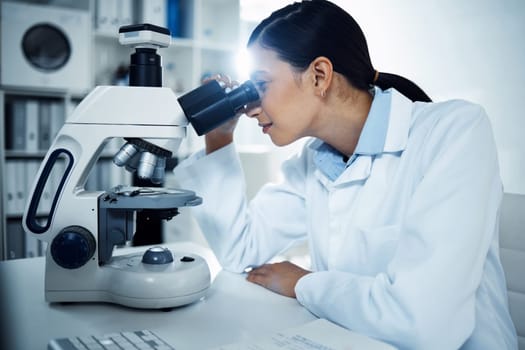 Science, laboratory and woman with microscope for medical analysis, research and test. Healthcare, biotechnology and female scientist with equipment for study, virus sample and medicine development.