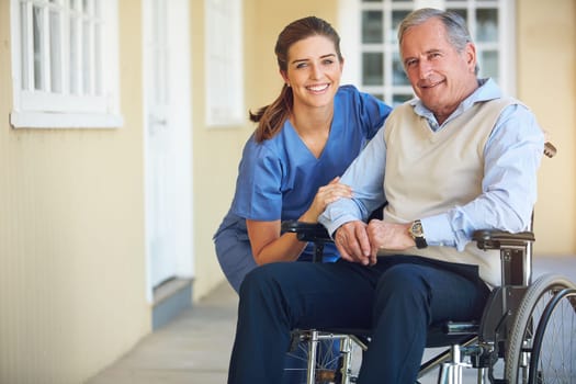 Portrait, caregiver or old man in a wheelchair in hospital helping an elderly patient for support in clinic. Happy, medical or healthcare social worker talking to a senior person with a disability.