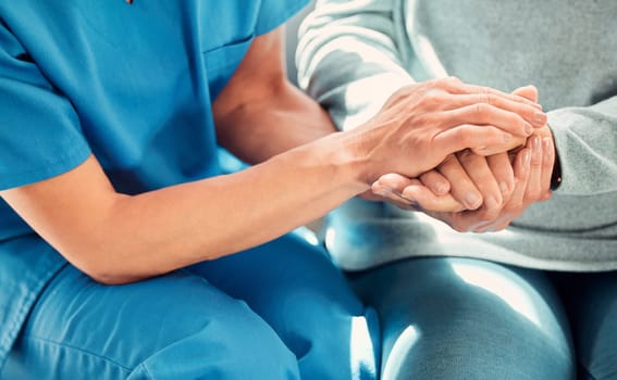 Holding hands, support and caregiver with senior person for care and trust in a nursing home for people in retirement. Nurse, help and elderly woman or patient with a professional for medical advice.