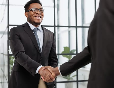 young black businessman shaking hands in the office