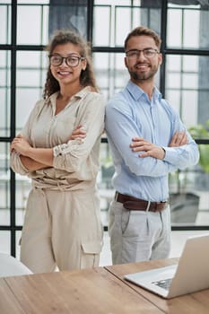 business people in the office arms crossed