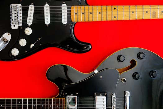 Electric Guitar on a red background.