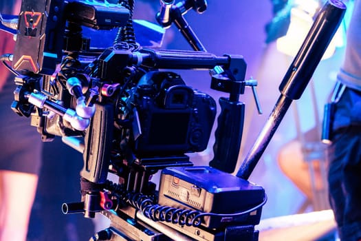 cinema video camera on tripod in film studio. Filmmaking equipment