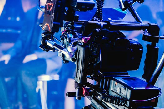 cinema video camera on tripod in film studio. Filmmaking equipment