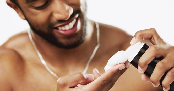 Skincare, cosmetics and man with shaving cream, grooming and hygiene against a grey studio background. Latino male, happy guy and facial foam for hair removal, wellness and product for beard and face.