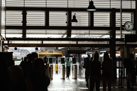 Access turnstiles at the rail station. Mid shot